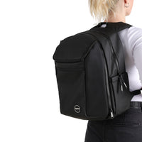 Person wearing a black modular backpack on a white background. 