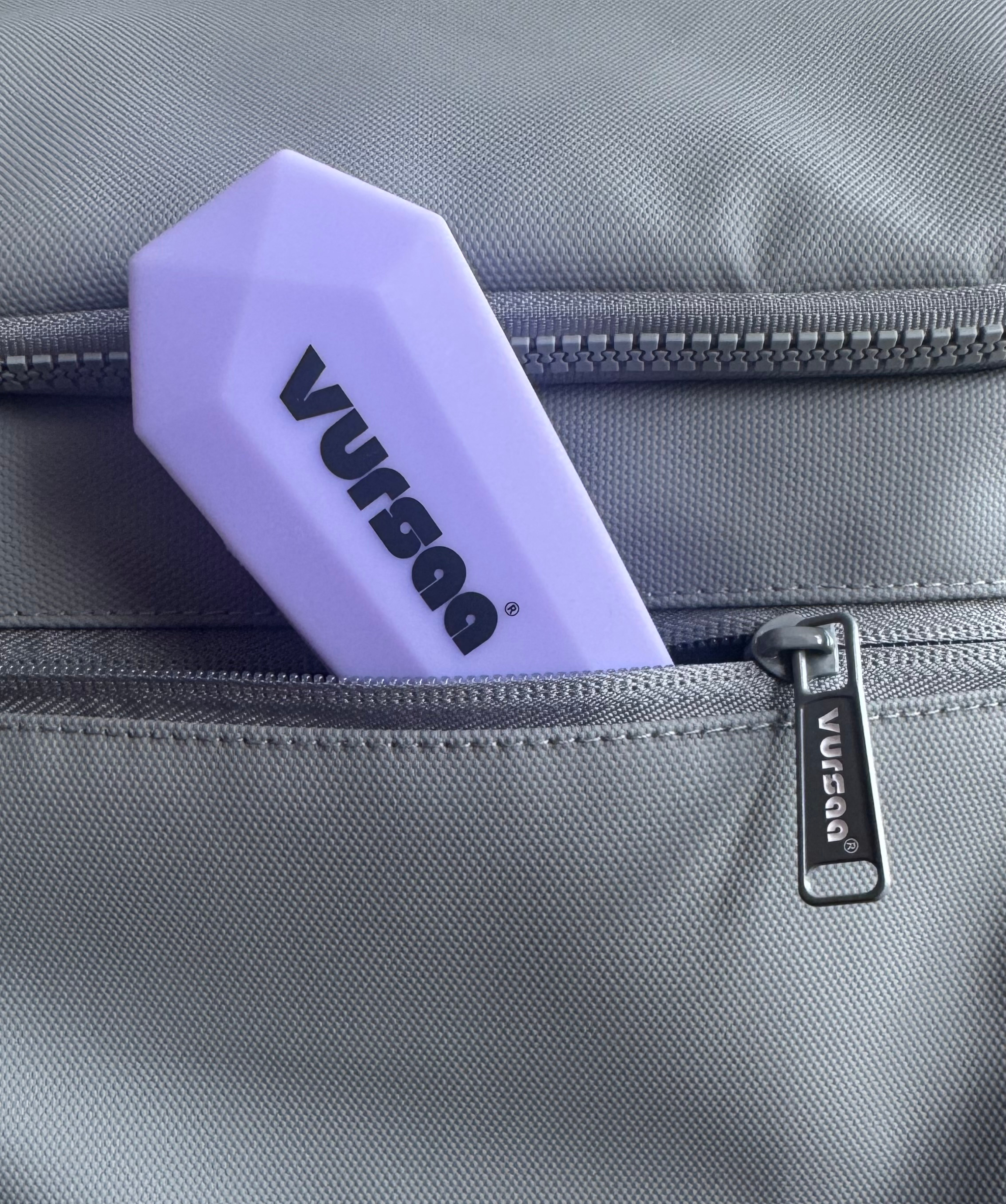 Vursaa Travel Utensil Set poking out of the Vursaa Orginal Backpack Pocket