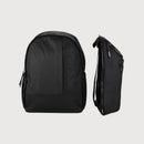 A black backpack shown from the front and side against a light gray background. The backpack features a vertical tonal logo on the front panel and a zippered side pocket.