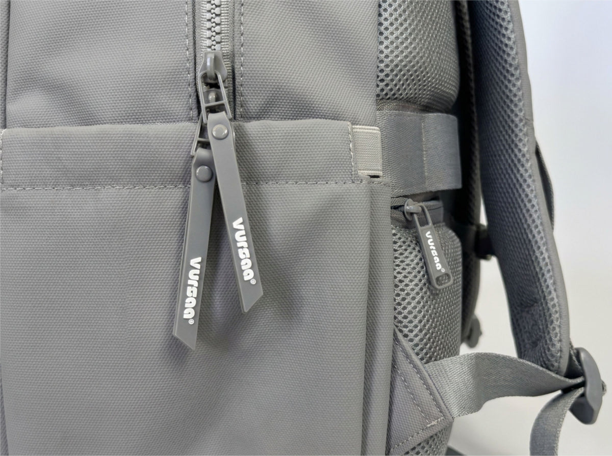 side profile of zips and water bottle holder visible logo on zips