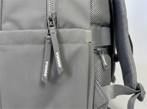 side profile of zips and water bottle holder visible logo on zips